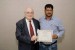 Dr. Nagib Callaos, General Chair, giving Prof. Tabrez Ahmad an award certificate in appreciation for his presentation oriented to inter-disciplinary communication entitled: "Technology Convergence and Cybersecurity: A Critical Analysis of Tehno-legal Challenges in India and USA."